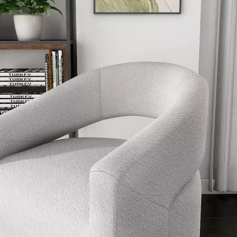 Fauteuil tonneau pivotant moderne en bouclé avec dossier ouvert