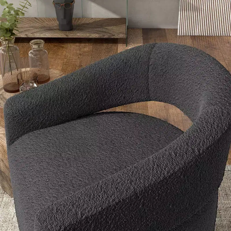 Fauteuil tonneau pivotant moderne en bouclé avec dossier ouvert